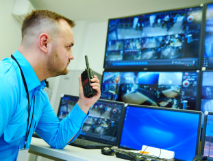 adult man holding radio phone